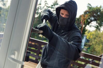 house robbery - burglar opens balcony doors with crowbar
